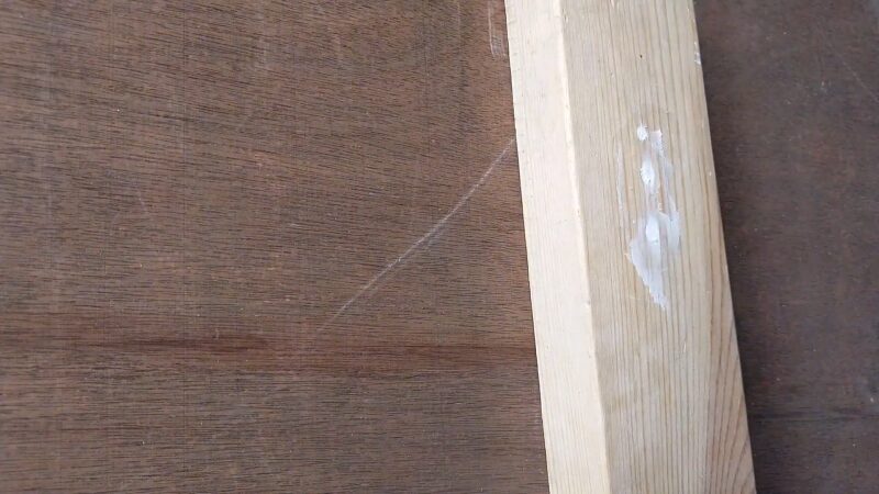 Applying Wood Filler to Fill Screw Holes in Cabinet Doors