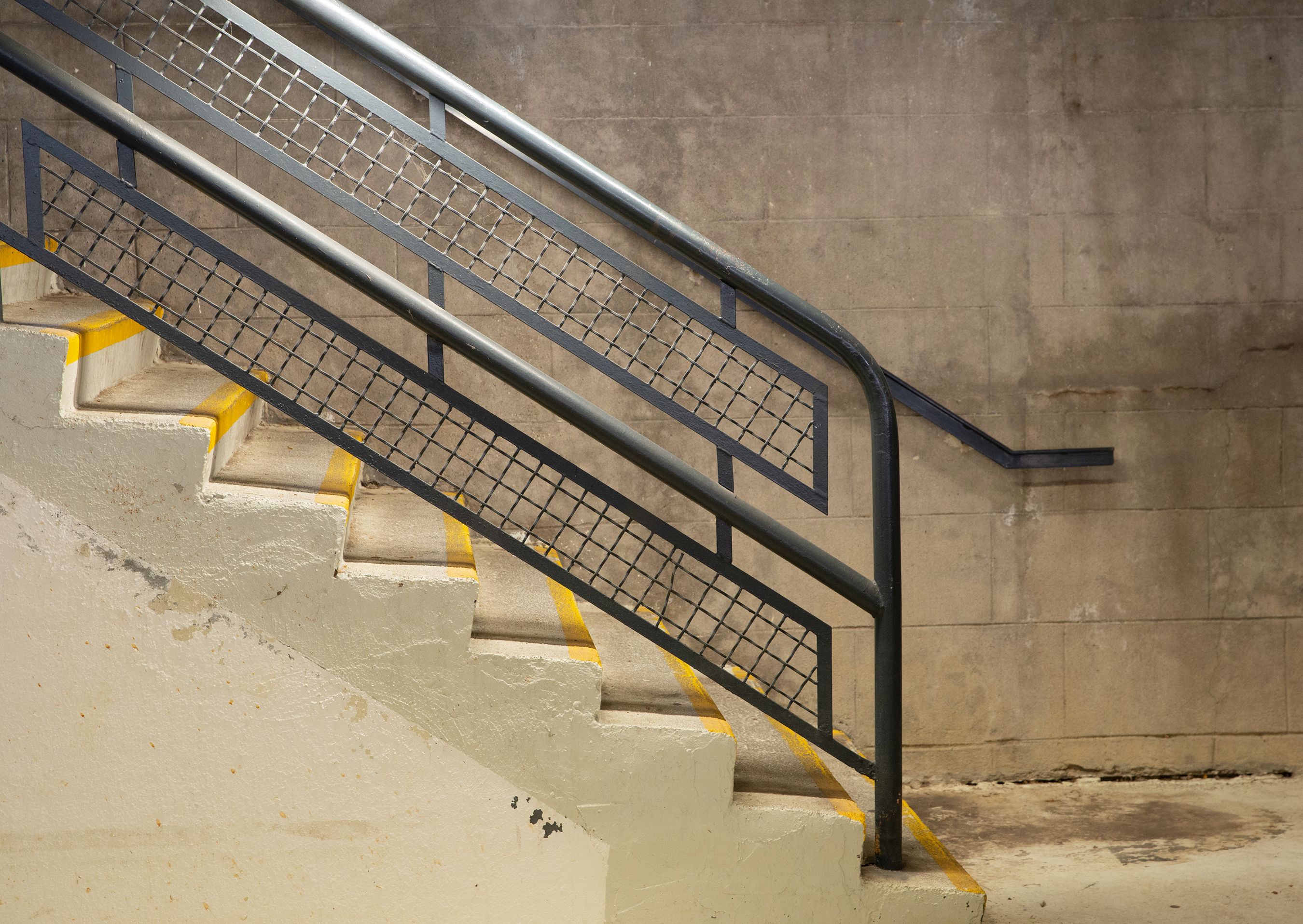 Modern staircase with metal handrails and industrial design